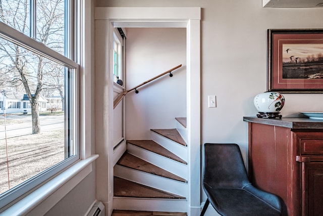 staircase featuring plenty of natural light