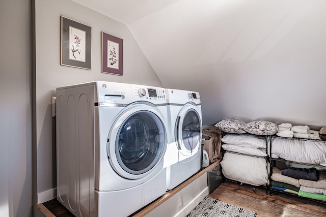 laundry area featuring separate washer and dryer and dark hardwood / wood-style floors