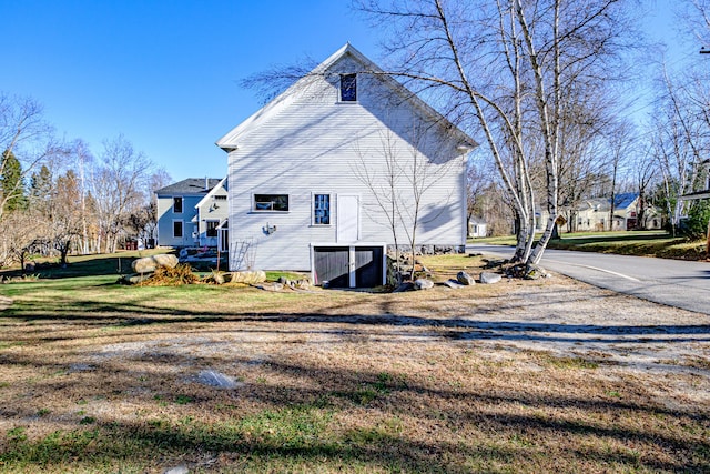 view of home's exterior featuring a yard