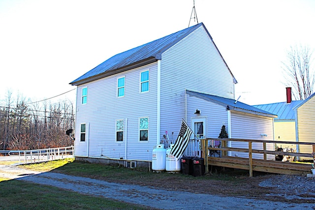 back of property with a deck