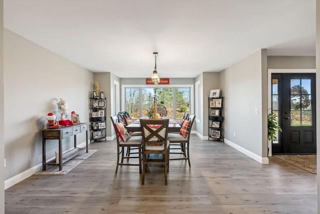 dining space featuring dark hardwood / wood-style floors