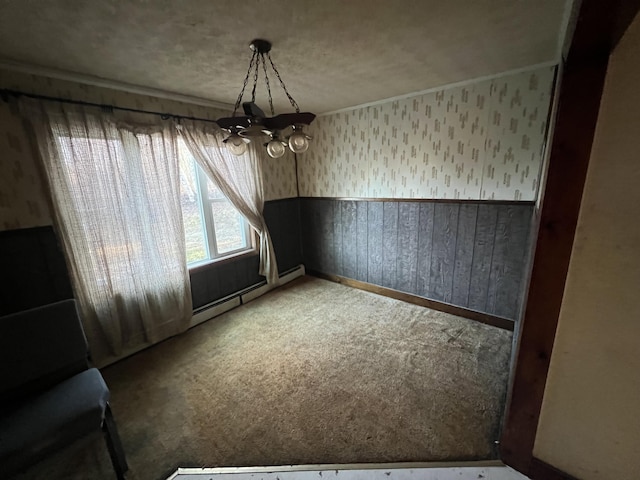 23 Hillcrest Ave, Millinocket, ME 04462 - unfurnished dining area featuring wallpapered walls, a chandelier, carpet, a baseboard radiator, and baseboards