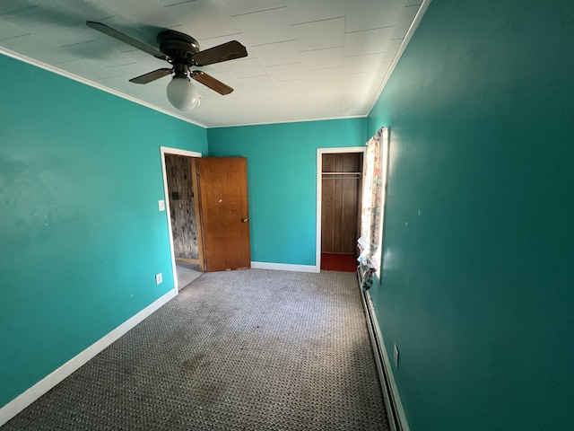 23 Hillcrest Ave, Millinocket, ME 04462 - unfurnished bedroom featuring crown molding, carpet floors, baseboards, ceiling fan, and a closet