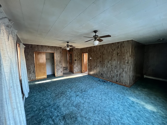 23 Hillcrest Ave, Millinocket, ME 04462 - unfurnished living room featuring carpet flooring, ceiling fan, and wooden walls