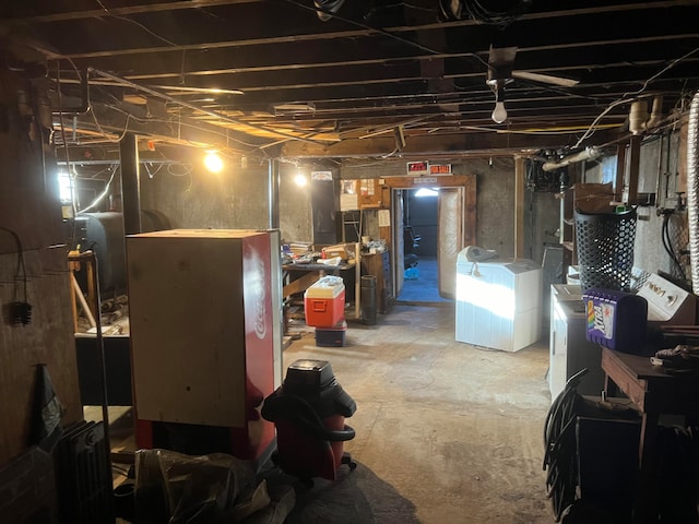 basement featuring washing machine and clothes dryer