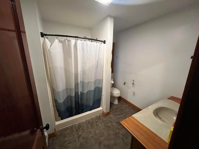 bathroom with tile patterned flooring, a shower with curtain, toilet, and vanity