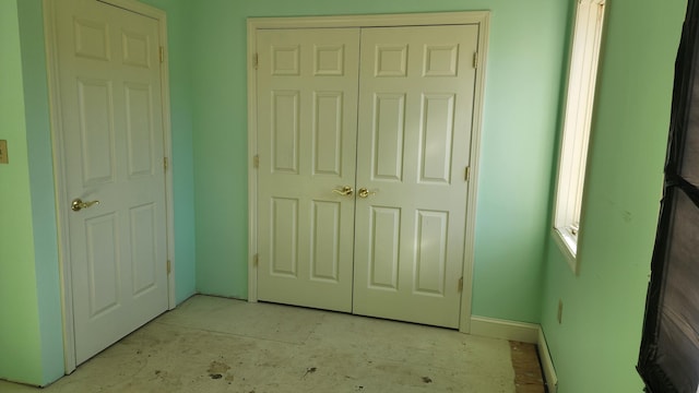 unfurnished bedroom with a closet