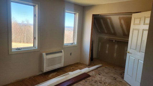 entryway featuring plenty of natural light and heating unit