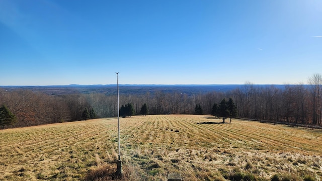 mountain view featuring a rural view