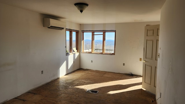 spare room with a wall mounted air conditioner