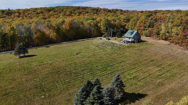 birds eye view of property with a rural view