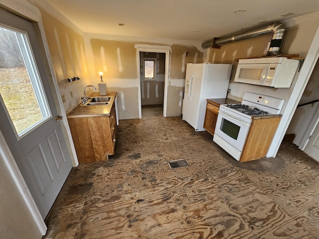 kitchen featuring sink and white appliances