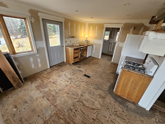 kitchen with white appliances and sink