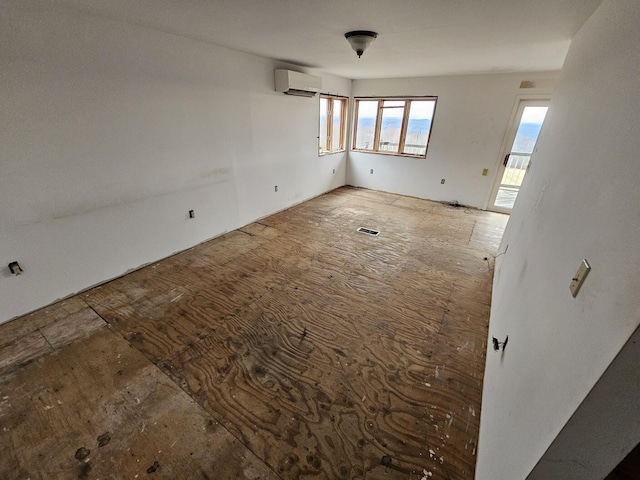 spare room with a wall mounted air conditioner