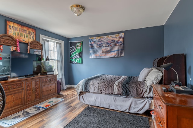 bedroom featuring hardwood / wood-style flooring