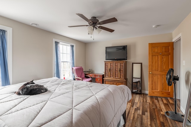 bedroom with ceiling fan and dark wood-type flooring