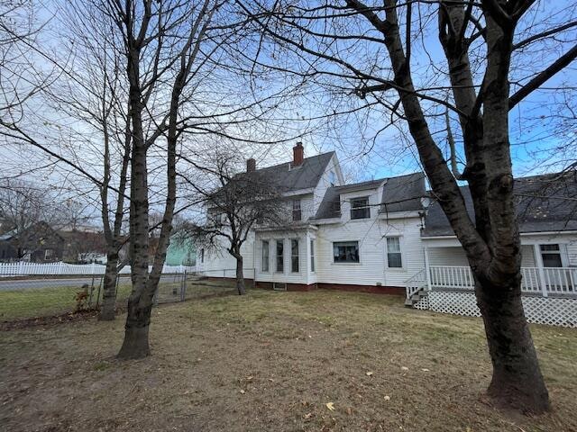 exterior space with a lawn and a deck