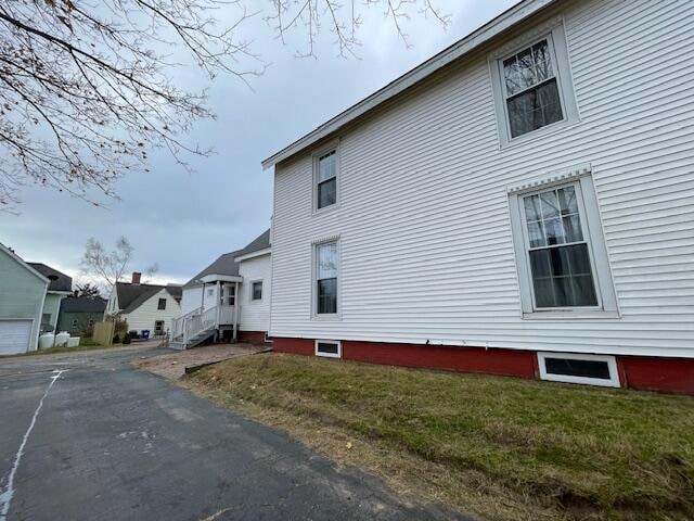 view of property exterior featuring a yard