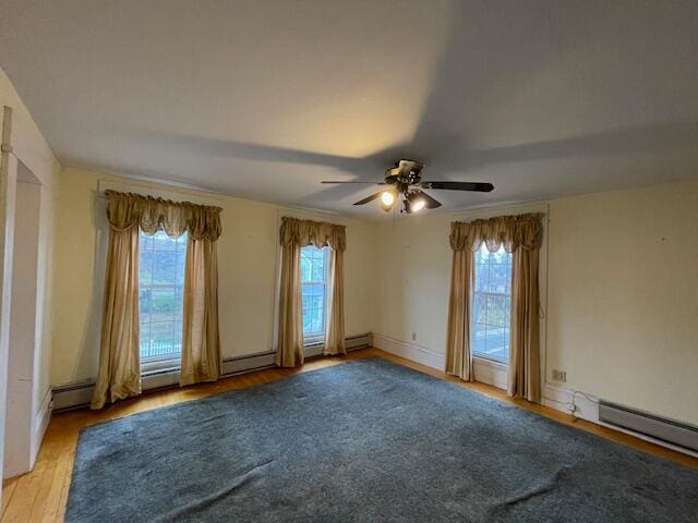 spare room featuring light wood-type flooring and ceiling fan