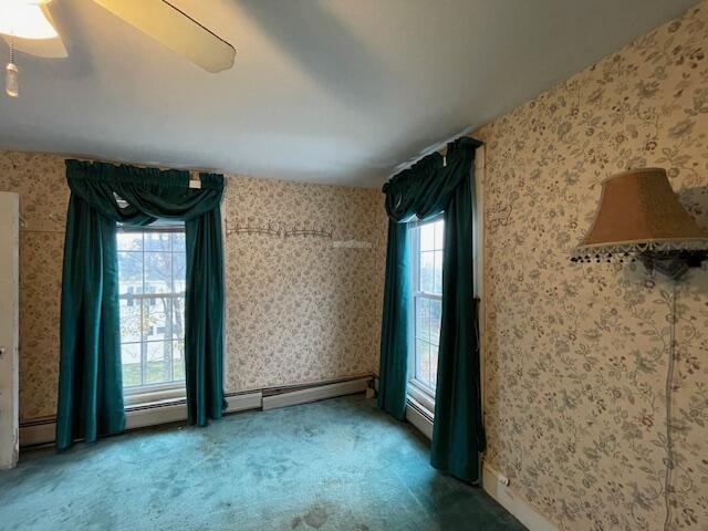 unfurnished room with carpet flooring and plenty of natural light