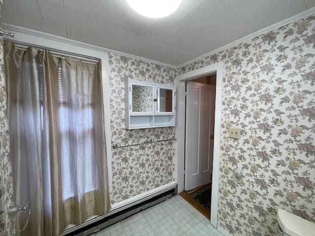 bathroom featuring toilet and ornamental molding