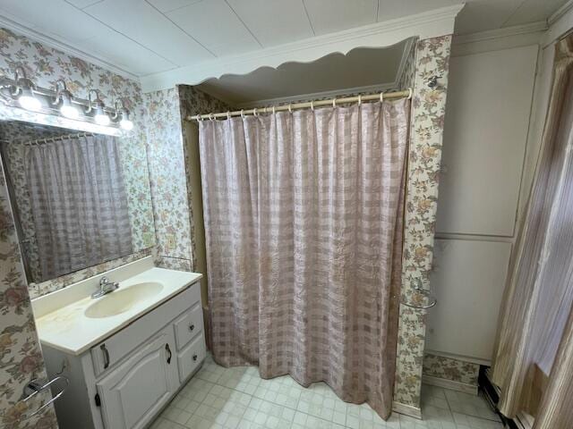 bathroom featuring vanity, curtained shower, and ornamental molding