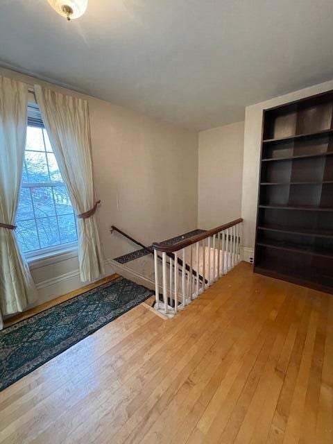 stairs with wood-type flooring