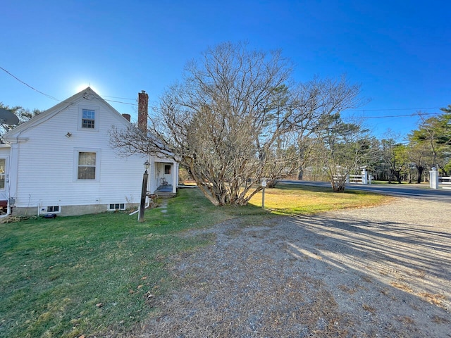 view of home's exterior featuring a lawn