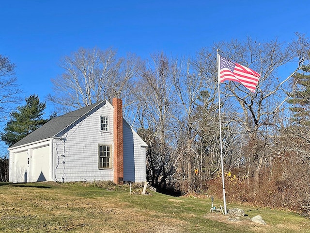 view of side of property featuring a yard