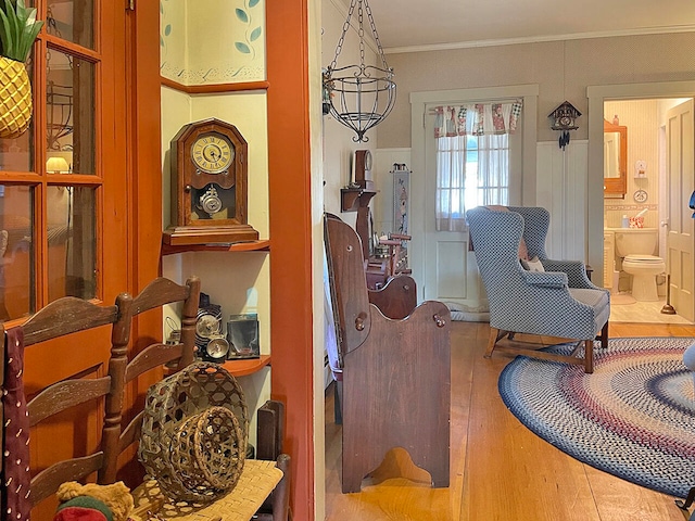 living area with crown molding