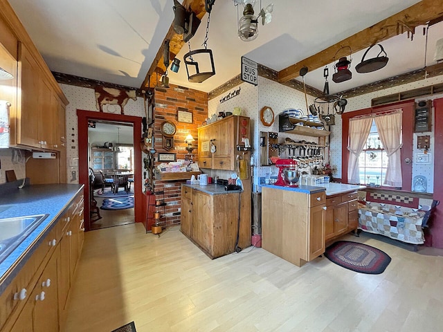 kitchen with light hardwood / wood-style floors and hanging light fixtures