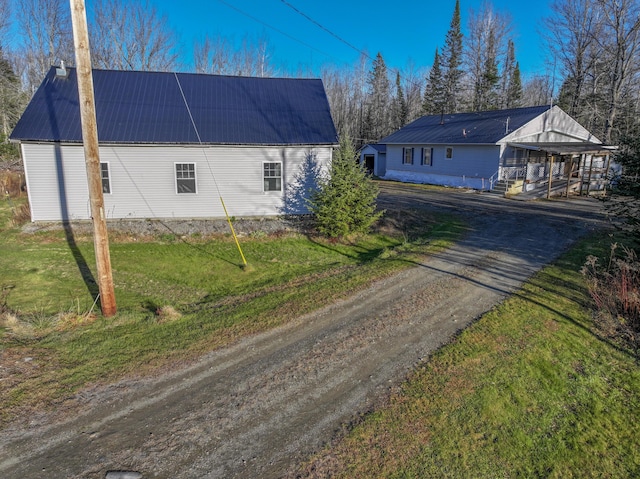 526 Darling Rd, Hudson, ME 04449 - view of side of property with driveway, metal roof, and a lawn