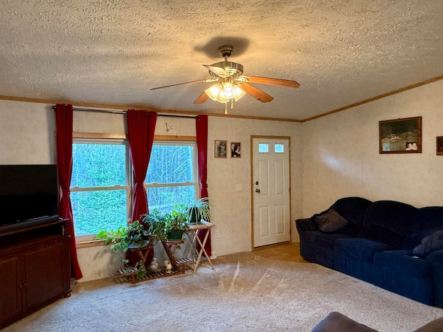 carpeted living room featuring ceiling fan, crown molding, and a textured ceiling