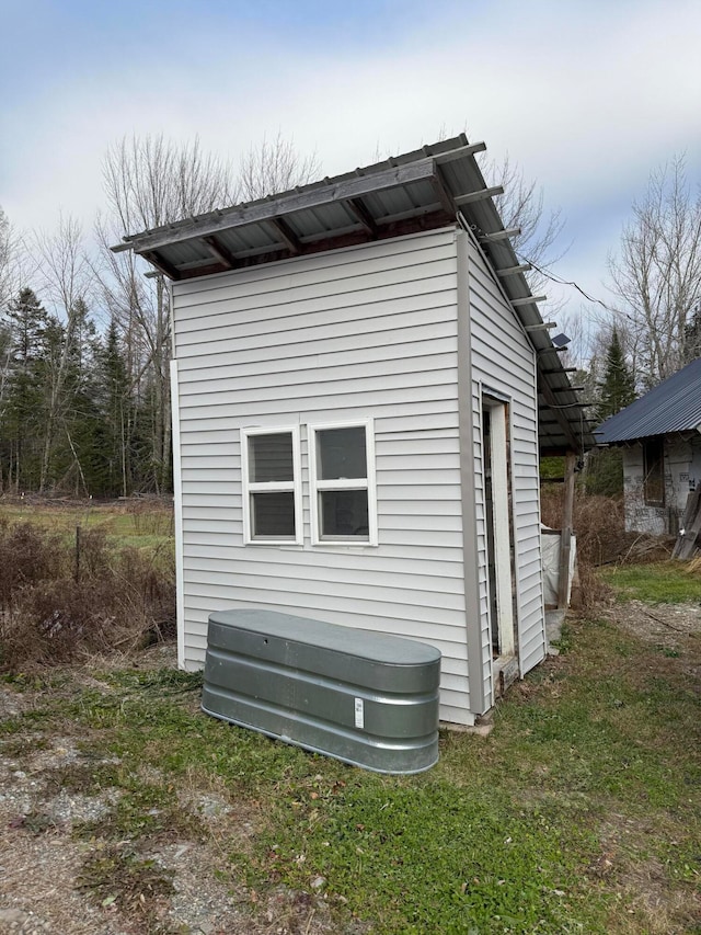 view of property exterior with a yard