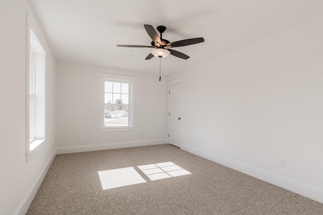 empty room with light carpet and ceiling fan