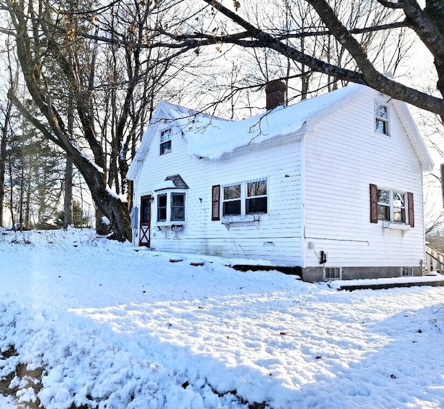 view of snow covered house