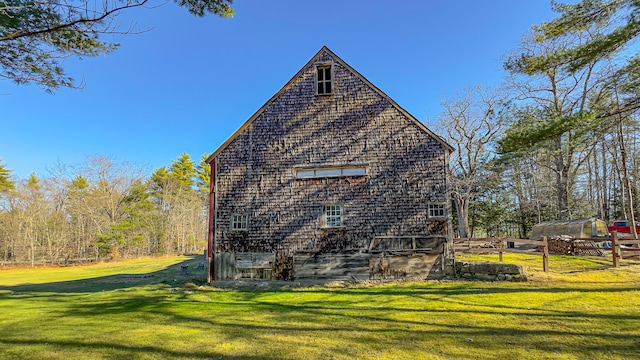 view of side of property with a yard