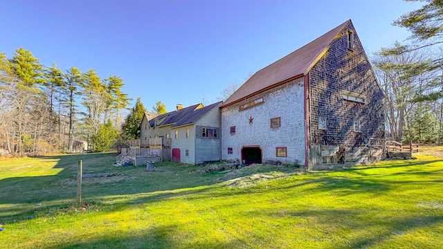 view of side of home featuring a lawn