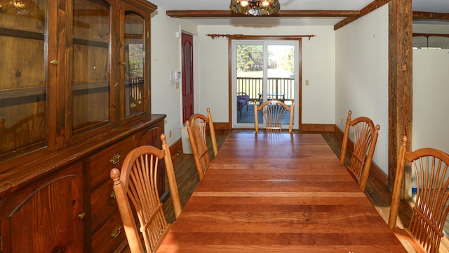 dining space with hardwood / wood-style floors