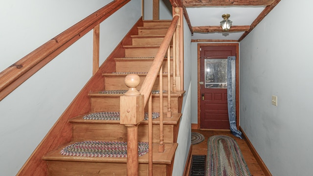 stairway with hardwood / wood-style flooring