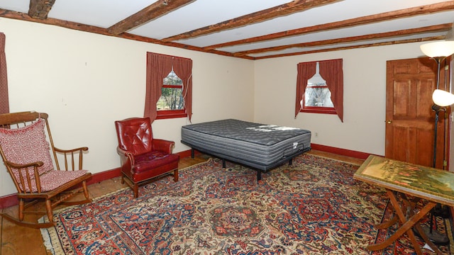 bedroom featuring beamed ceiling