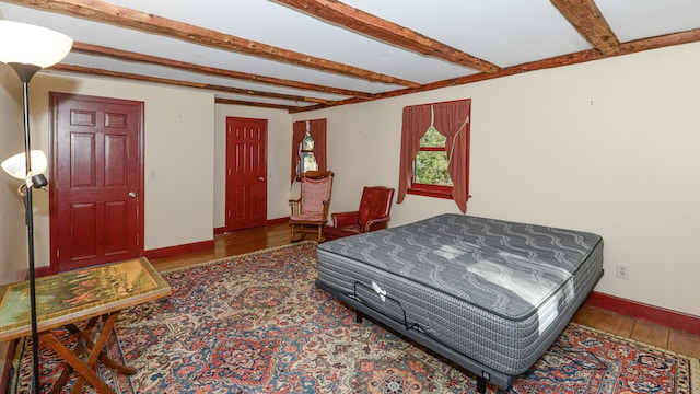 bedroom featuring beam ceiling