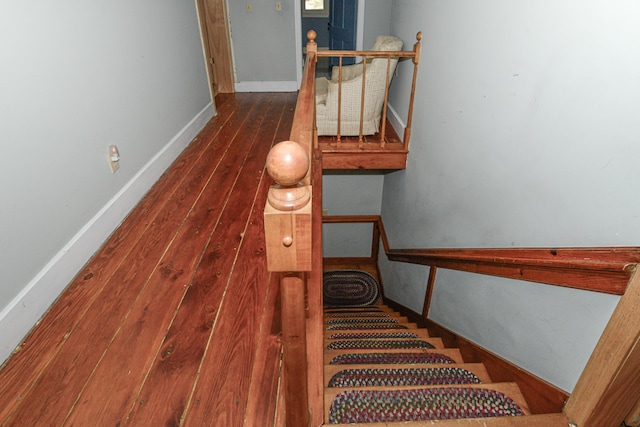 staircase featuring wood-type flooring