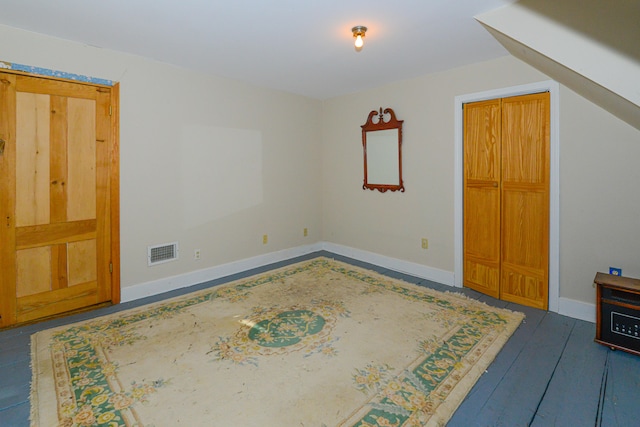 interior space with dark hardwood / wood-style flooring