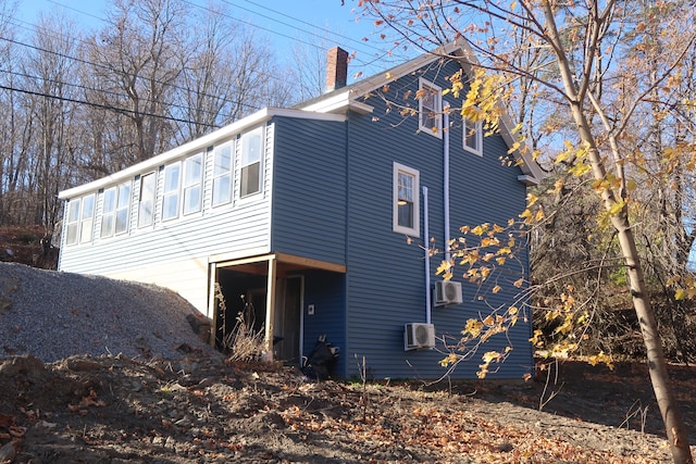 view of side of home with cooling unit