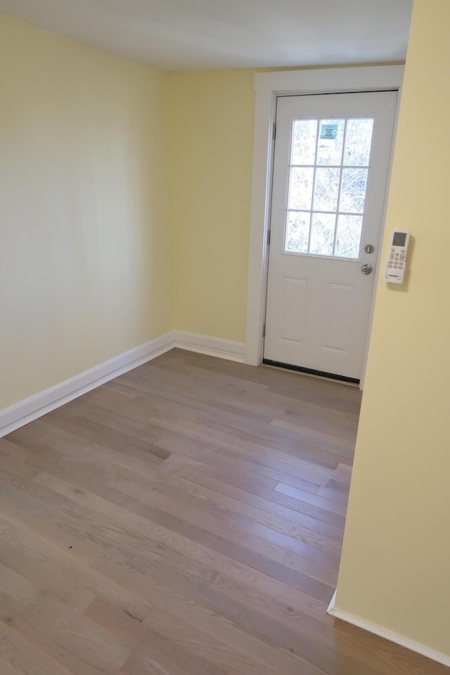 doorway to outside with light hardwood / wood-style flooring