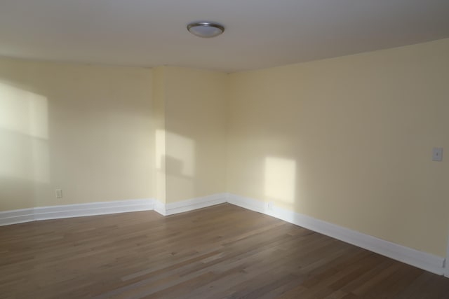 empty room with hardwood / wood-style floors