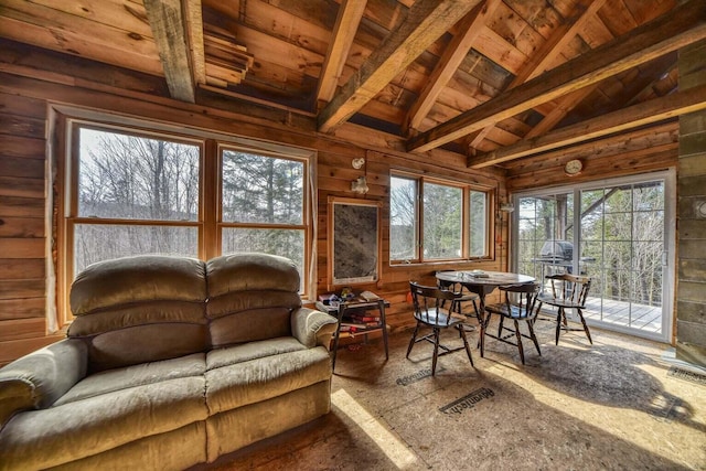 sunroom / solarium featuring vaulted ceiling with beams and wood ceiling