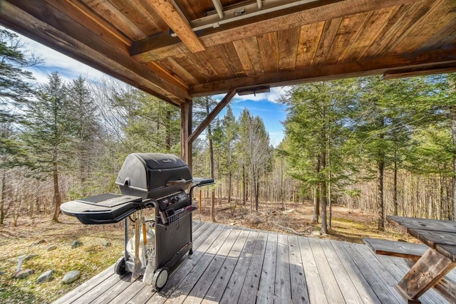 wooden terrace featuring area for grilling