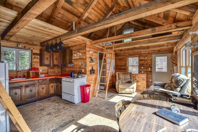 kitchen featuring lofted ceiling with beams, white appliances, sink, and wood ceiling